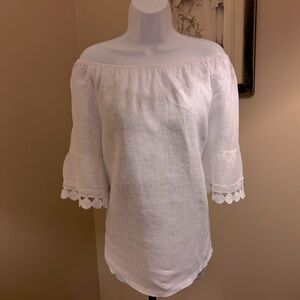 100% white Linen peasant style blouse. Off or on shoulder. Size Medium